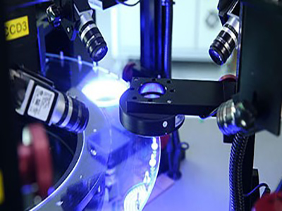 Why do industrial robots use machine vision systems?
